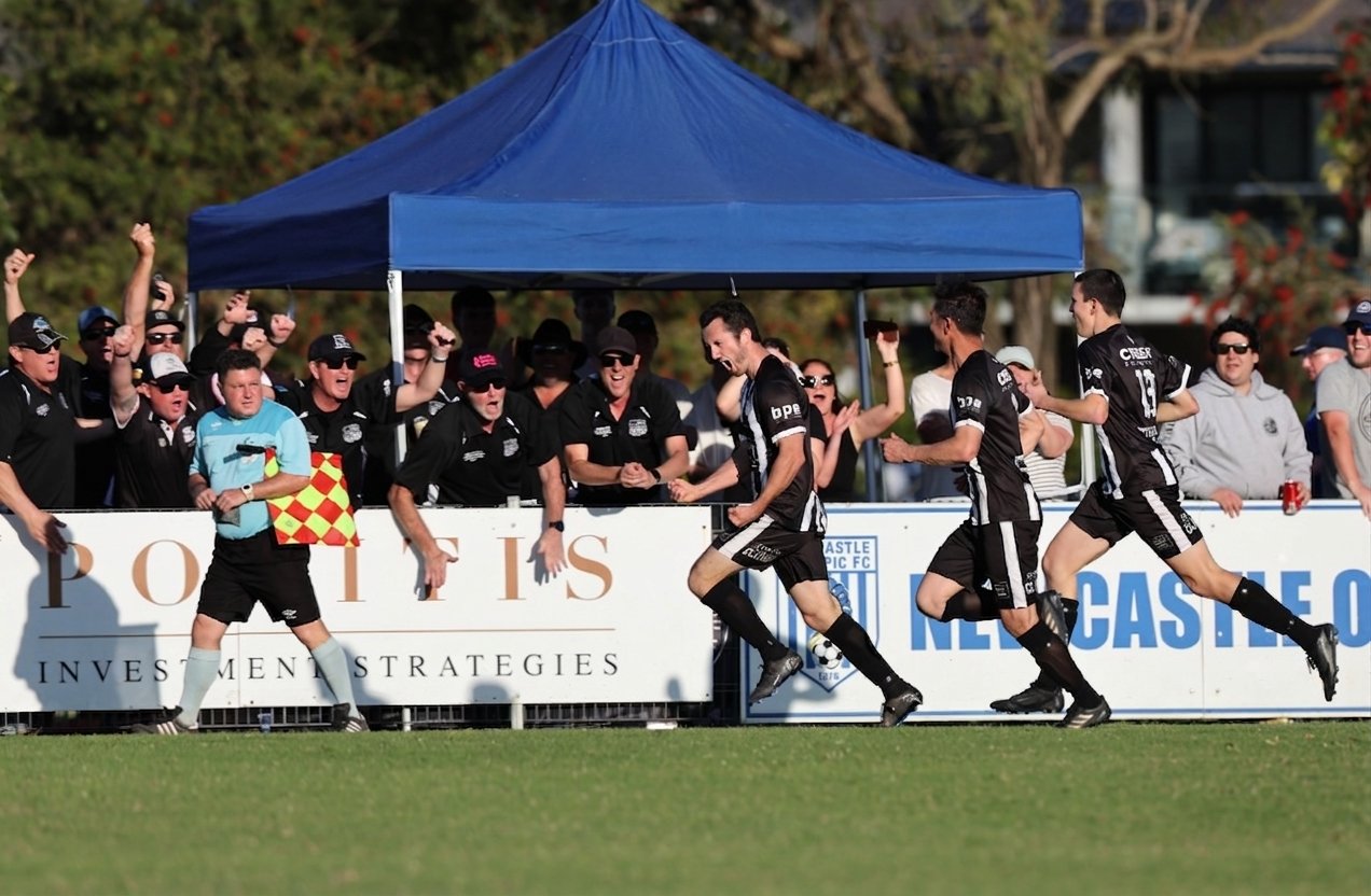 Dudley Redhead United grade men&rsquo;s side celebrating a goal in front of a packed sideline
